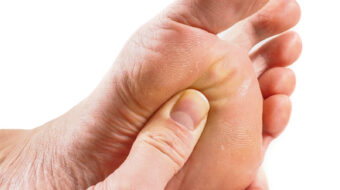 Male Person Receiving Podiatry With Pressure Point Technique